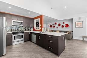 a kitchen with a counter top and a refrigerator