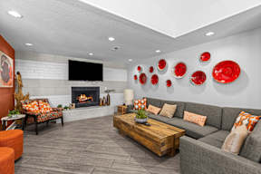 a living room with couches and a fireplace