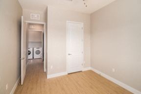 A laundry room with a washer and dryer in it.