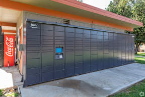 A dark grey garage door with the word Hub on it.