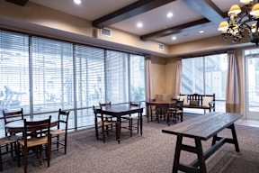 A room with a table and chairs in it.
