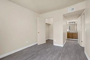 A room with a doorway leading to another room.