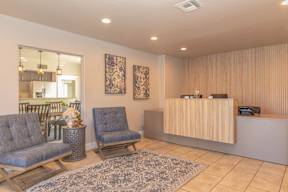 A reception area with two chairs and a reception desk.