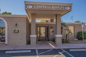 The entrance to the Campbell Ranch community with a sign above the door.