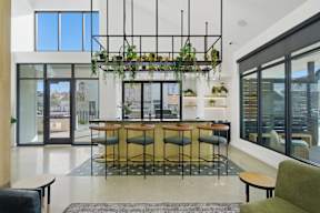 A modern interior with a bar and seating area.