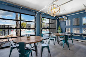 A dining area with a table and chairs.