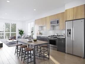 A modern kitchen with a dining table and chairs.