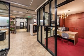 Entryway lounge and leasing office with view to coffee bar and mailroom