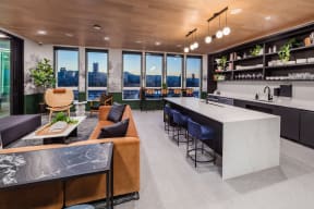 Social lounge kitchen and lounge with oven, dish washer, and sink