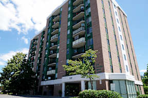 an apartment building on the corner of a street