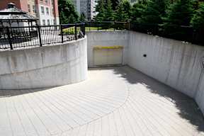 the entrance to a parking garage with a white door