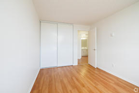 A room with a white wall and a white door.