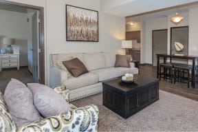 a living room with a couch and a coffee table at InterUrban Apartments, Montana, 59106