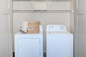 a washer and dryer in a laundry room at InterUrban Apartments, Billings, MT 59106
