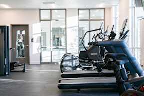 A gym with treadmills and exercise equipment.at Copestone Apartments, Garden City, ID 59808