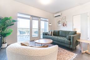 Living Room With Balcony at Copestone Apartments, Garden City, ID