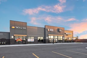 a rendering of the exterior of a taco bell restaurant in a parking lot at Shiloh Commons, Billings