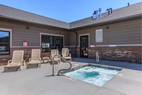take a dip in the hot tub at the whispering winds apartments in pearland, tx at InterUrban Apartments, Montana