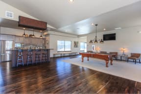 a game room with a foosball table and a bar at InterUrban Apartments, Montana, 59106