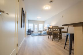 a living room and dining room in a two bedroom apartment at Shiloh Commons, Montana
