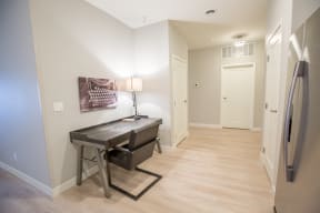 a bedroom with a desk and a refrigerator at Shiloh Commons, Billings, MT 59102