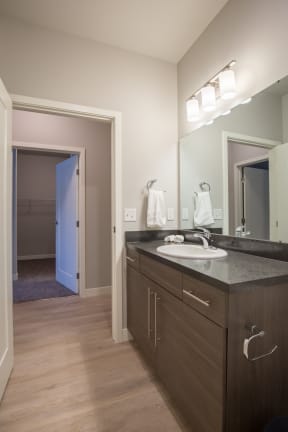 a bathroom with a sink and a mirror at Shiloh Commons, Montana, 59102