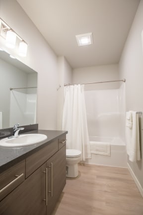 a bathroom with a toilet sink and shower at Shiloh Commons, Billings Montana