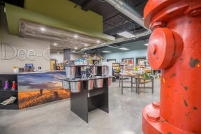 a large red fire hydrant in the middle of a room at Shiloh Commons, Billings