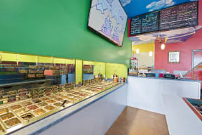 a photo of the interior of a dunkin donuts restaurant with a green wall and white  at Shiloh Commons, Billings, MT 59102