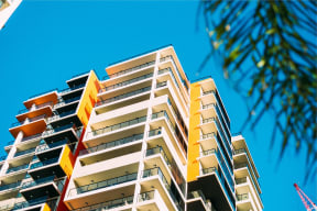 a tall building with a blue sky in the background