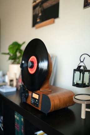 a vinyl record player sitting on top of a desk