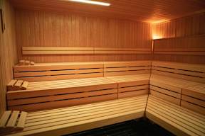 A row of wooden benches in a sauna.