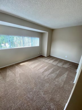 Large bedroom with lots of natural light and great view at Grande Vista Apartments.