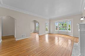 A room with wooden floors and white walls.