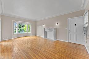 A room with wooden floors and white walls.