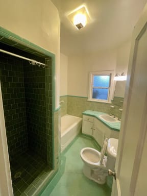 Bathroom with vintage tile at Orange Grove Apartments in Pasadena, CA.