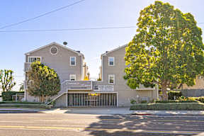 A building with a sign that says "Somersby Estate" and "NO NEW LEASING".