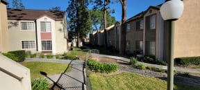 Walkway between building complexes at Northwood Apartments in Upland, California.