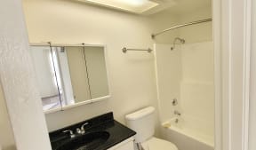 Bedroom ensuite bathroom at Northwood Apartments in Upland, California.