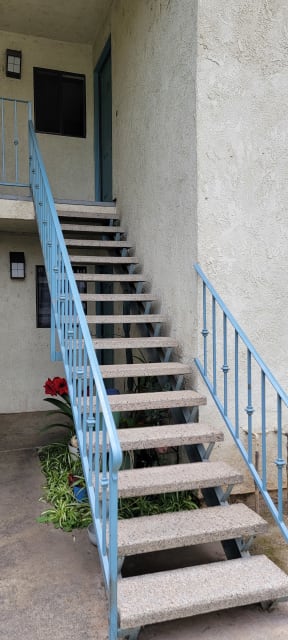 Stairway to second floor apartment at Magnolia Apartments in Riverside, California.