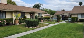 Well cared for gardens and lawn at Las Casitas Apartments in Riverside, California.