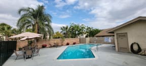Swimming pool and sun deck at Las Casitas Apartments in Riverside, California.