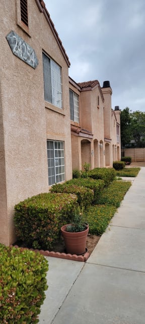 Sidewalk between buildings at Palos Verdes Village Townhomes.
