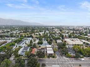 A cityscape with a mountain in the background.