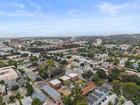 A bird's eye view of a residential area with houses and trees.