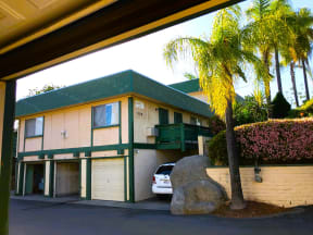 Private garages and parking below units at Tulip Street Apartments in Escondido, California.