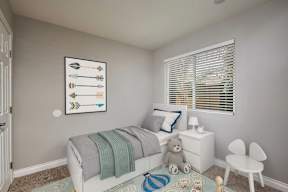 A child's bedroom with a white bed, a teddy bear, and a framed picture of arrows on the wall.