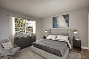 A bedroom with a large bed, a chair, and a painting on the wall.