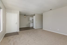 View from living room of entry, dining and kitchen area and hallway to bedrooms at Solara Apartments.