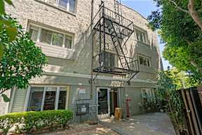 A building with a fire escape on the side.